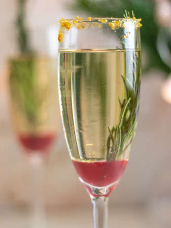 Mimosa festive drink for Christmas - champagne red cocktail Mimosa with cranberry for Christmas partyの写真素材