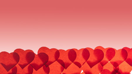 Translucent paper hearts on a pink gradient background