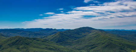 panorama of a beautiful mountainous area. sunny in the afternoon. beautiful spring landscape in the mountains.の写真素材