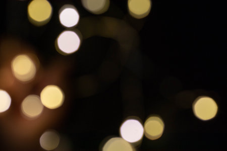 Gold bokeh on a black background. Overlayの写真素材