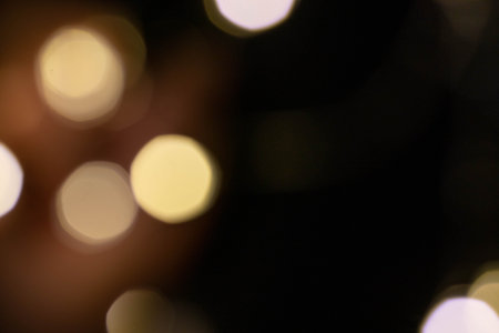 Gold bokeh on a black background. Overlayの写真素材