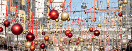 Christmas and New Year decoration of the street. large Christmas balls hang on gold ribbons. high quality photoの写真素材