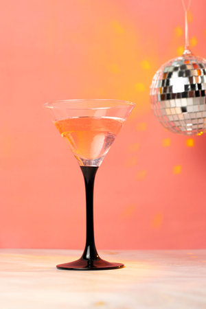 Martini glass with cocktail on a pink backgroundの写真素材