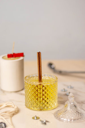 Hot soy wax is poured into a glass beaker. Candle Makingの写真素材