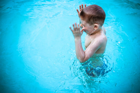 Child Enjoying Swimming in a Pool