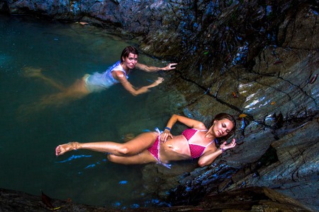 Young womans in a tropical waterfall on Koh Samuiの写真素材