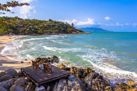 Two beach-chair beside the nice beachの写真素材