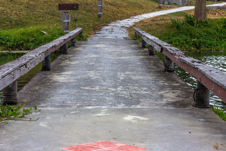 Bridge across a pondの写真素材
