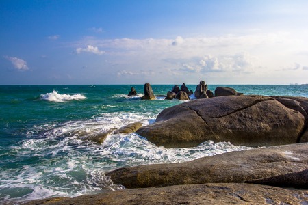 Stones in a sea and blue skyの写真素材