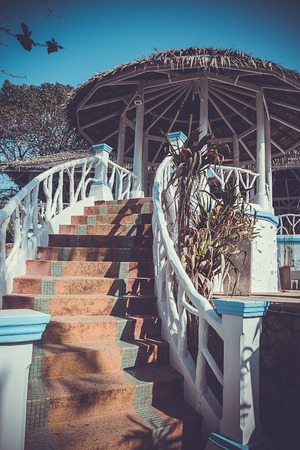 Steps leading to the gazebo under roofの写真素材