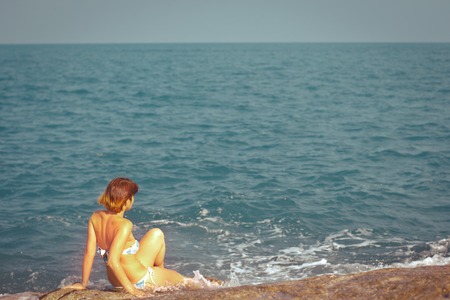 Young beautiful woman near the seaの写真素材