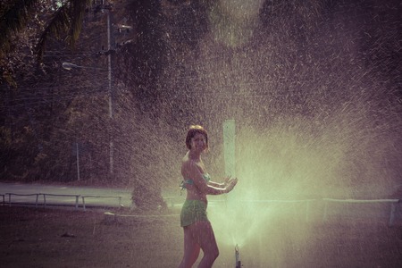 Wet woman in Splashing waterの写真素材