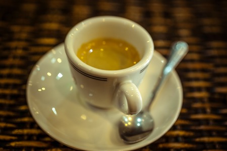 Close up of espresso cup on wood surface. Macroの写真素材