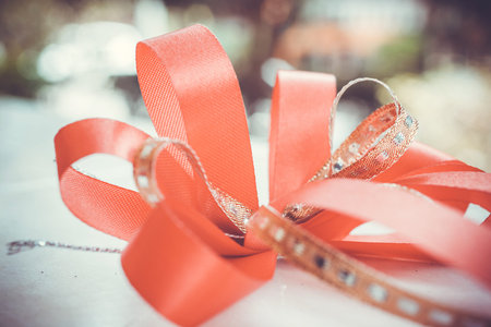 Red satin gift bow. Ribbon. Macro close upの写真素材