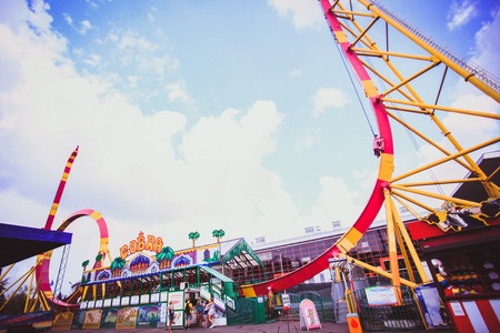 Colorful Looping Roller Coaster On Beautiful Sunny Day in Moscowのeditorial素材
