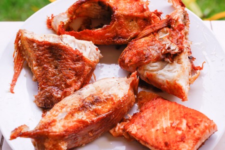 Tasty baked fish steaks on plateの写真素材