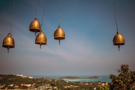 golden bells on the background of skyの写真素材