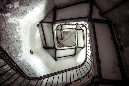 Upside view of spiral stairway case in a lighthouse