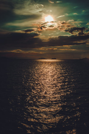Panoramic dramatic sunset sky with clouds and tropical sea at dusk