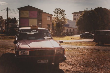 Retro car parked in old city street in Malaysia.のeditorial素材