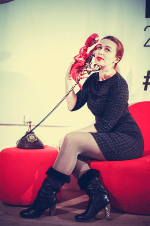 Lovely woman talking on the phone. Retro portraitの写真素材