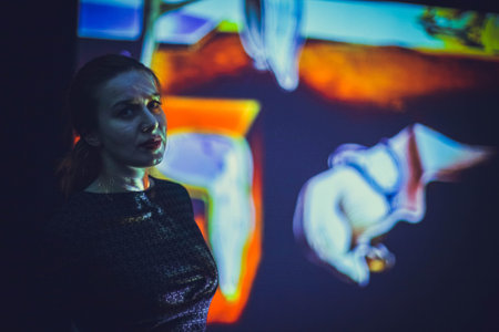 Dramatic portrait of a girl theme: portrait of a beautiful lonely girl on a dark background in studioの写真素材