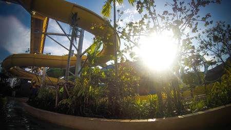 Thailand, Hua Hin, 27 bovember 2015. Slide in water park on sky and sun backgroundのeditorial素材