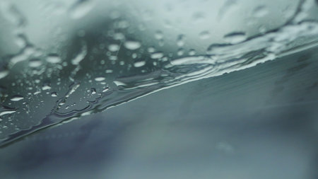 Rain falling on glass during rain storm