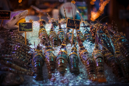 Fresh seafood on ice at the fish marketの写真素材