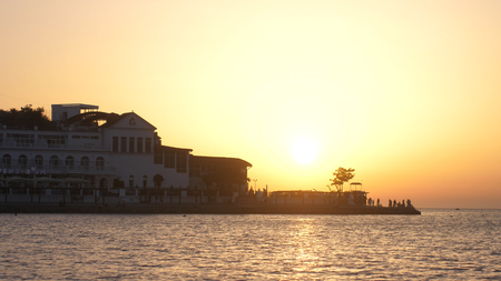 Russia, Crimea, 1 july 2017. Golden sunset over Beautiful coast with hotel.のeditorial素材