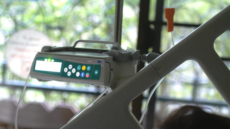 Intravenous drip with ECG monitor in operation room.