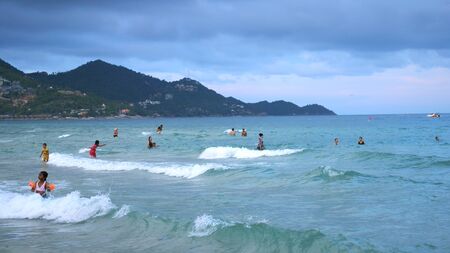 KOH Samui,THAILAND, APRIL 27, 2018. Chaweng beach. Unidentified people swimming in the sea. slow motion.のeditorial素材