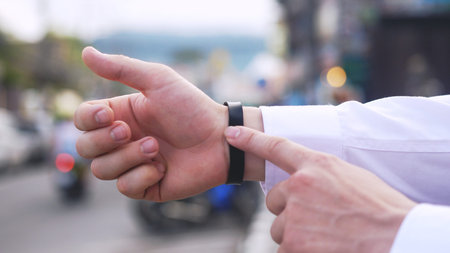 Man hands use smartwatch on street content touch display communication business connection internet...