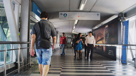 Kuala Lumpur, Malaysia, 5 july 2018. Unidentified people walk through overpass.