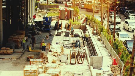 Kuala Lumpur, Malaysia. 5 july 2018. Moving traffic on the road at rush hour. Constraction workers are Working during sunsetのeditorial素材
