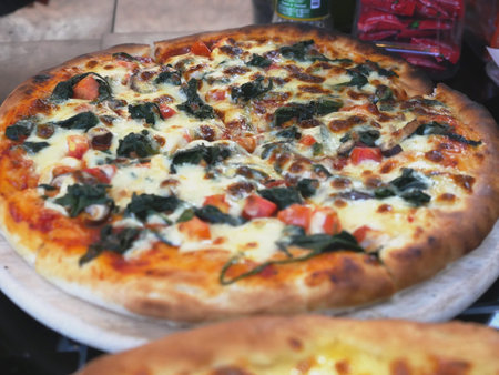 Pizza Margarita with Tomatoes, Basil and Mozzarella Cheese close up.の写真素材