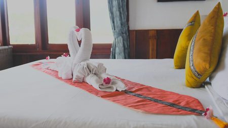 Beautiful swans made from white towels in Koh Phangan island hotelの写真素材