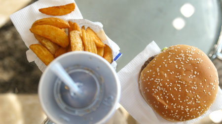 Fast food menu with burger,sauce, fries and cola