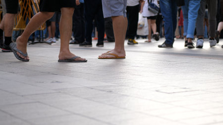 Many people walk down the street. Close up of feet. Thailand, Bangkok, 2019のeditorial素材