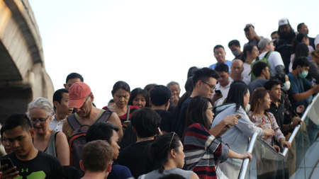 Diverse and Multicultural Office Managers and Business People walking to work in business district, commuting in downtown from back, busy city life. Thailand, Bangkok, 2019のeditorial素材