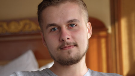 Smiling bearded millennial professional businessman looking at camera. Happy confident handsome...