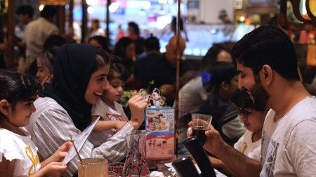 Happy family dinner at pan-Asian restaurant with children. slow motion. Thailand, Bangkok, 2019のeditorial素材