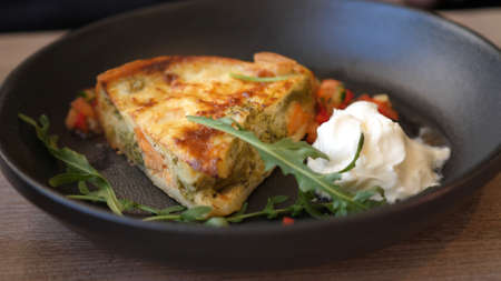 Delicious French Quiche aux legumes and salmon in a pan - Vegetable quicheの写真素材