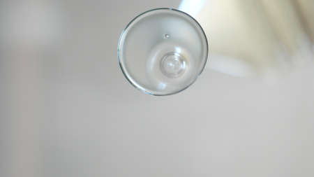 Pouring Oil Liquid. Oil Splashing and Flowing. Liquid cosmetic oil. Face and hands skin care concept. Sauna spa exotic therapy treatment for body.の写真素材