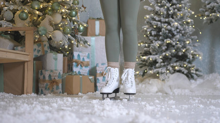 Happy young woman skates on ice rink