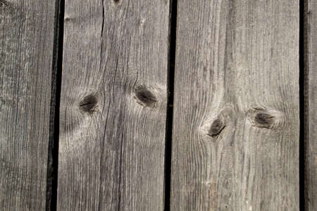Wooden planks with knots and nail holes. Background texture.の写真素材