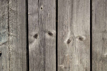 Wooden planks background. Texture of old wooden boards with knots.の写真素材