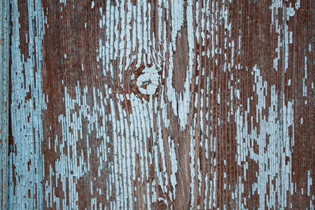 Old wooden background with peeling paint. Wooden texture with cracked paint.の写真素材