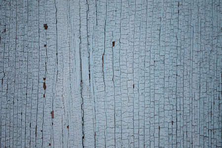 Old painted wood wall texture background. Cracked blue paint on wooden surface.の写真素材