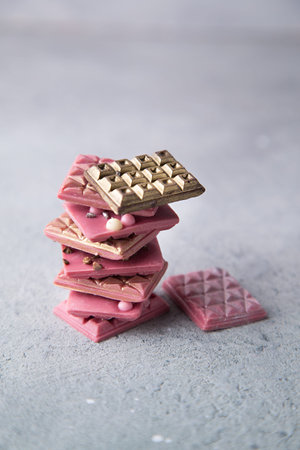 Broken pink Ruby chocolate bar pieces, made from ruby cocoa beans